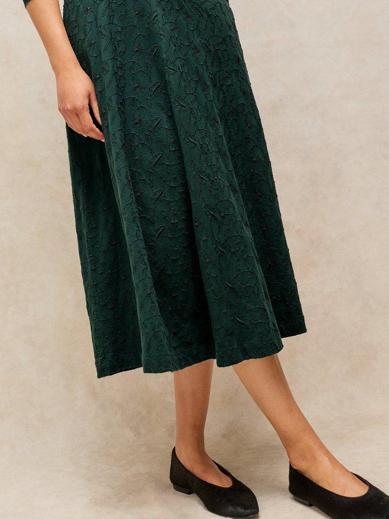 MEGAN EMBROIDERED JERSEY DRESS in DK GREEN - MODEL DETAIL