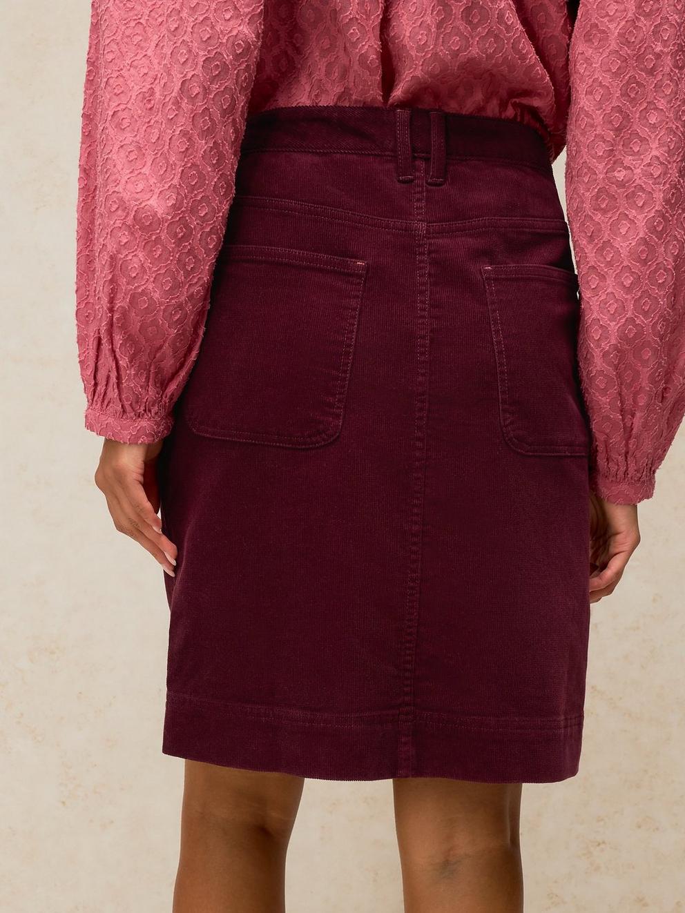 TIA CORD SKIRT in DK PLUM - MODEL BACK