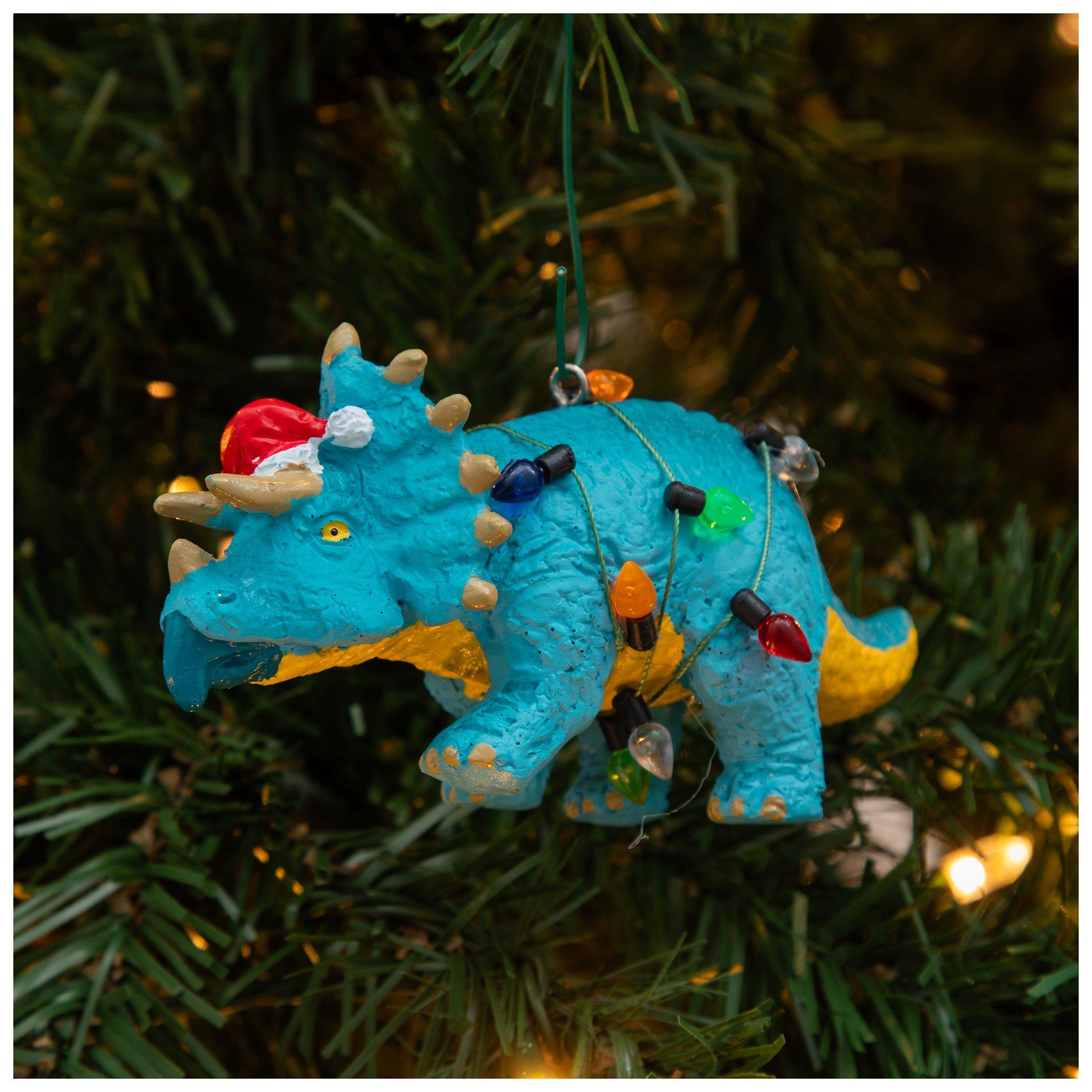 A blue dinosaur Christmas ornament