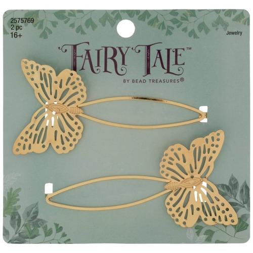 Two gold openwork butterfly hair clips on a printed retail card