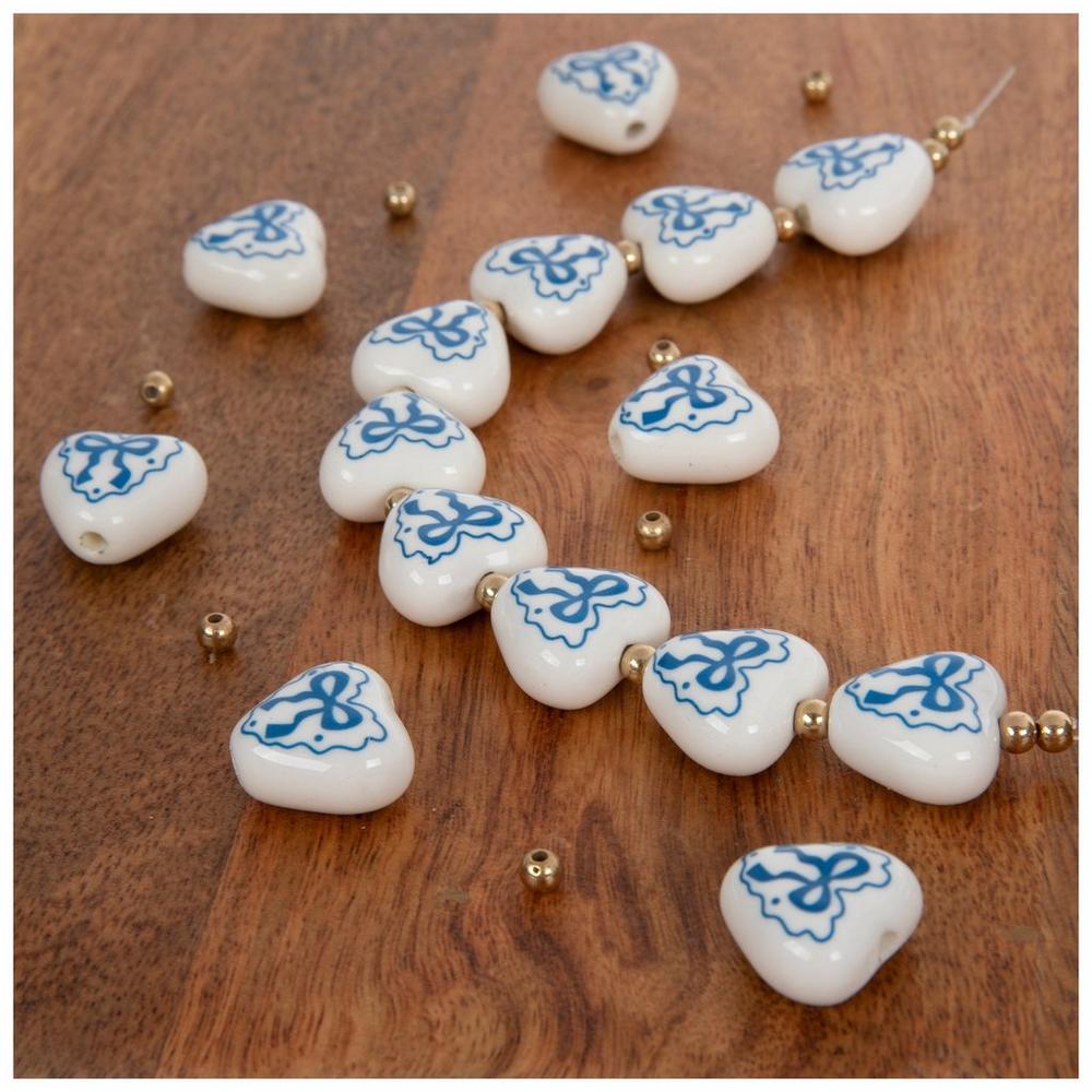 Blue Bow Hearts Ceramic Bead Strand | Hobby Lobby | 2580462