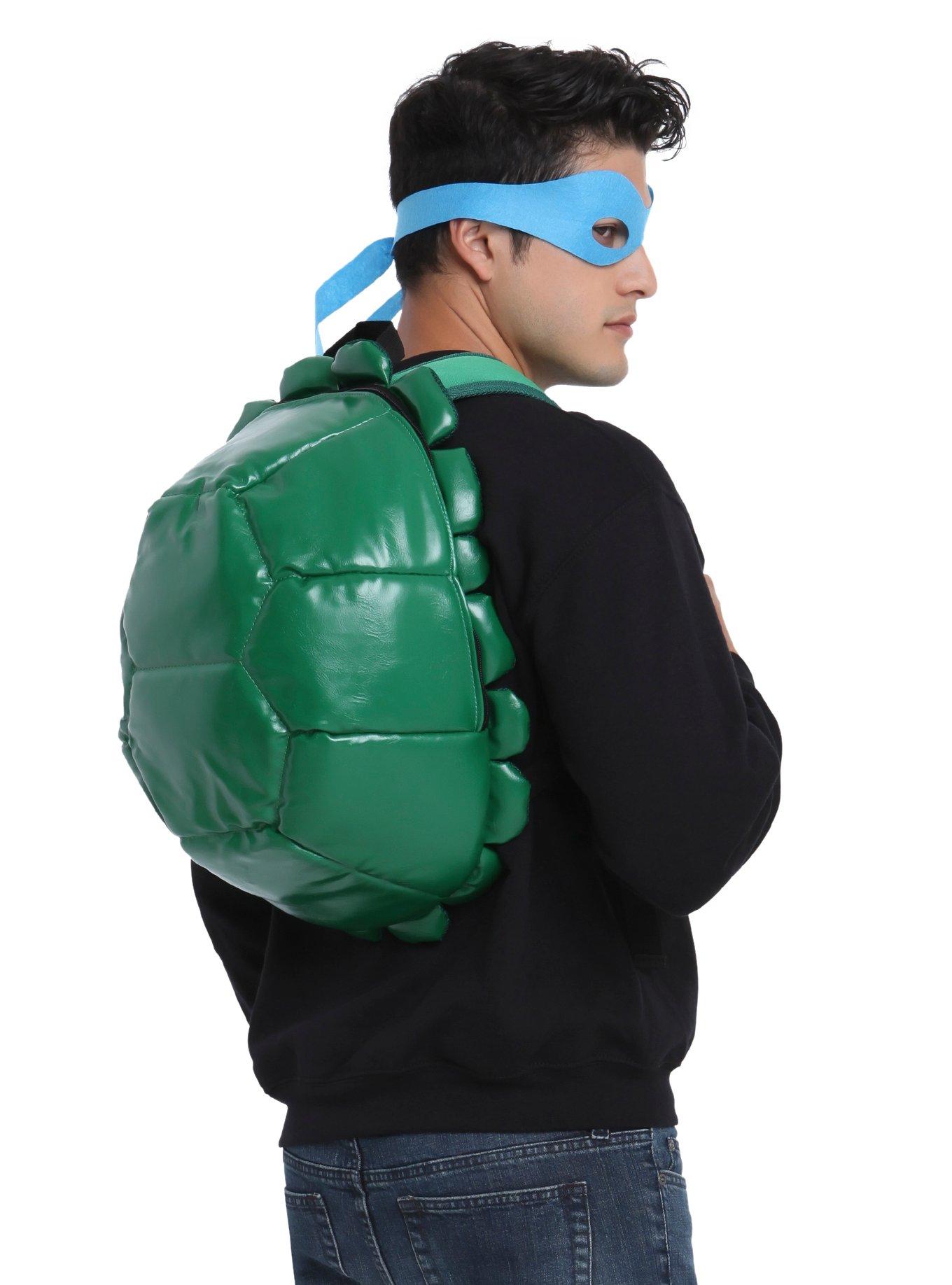 This Teenage Mutant Ninja Turtle backpack is in the shape of a half-shell  and includes four TMNT masks. Tur…