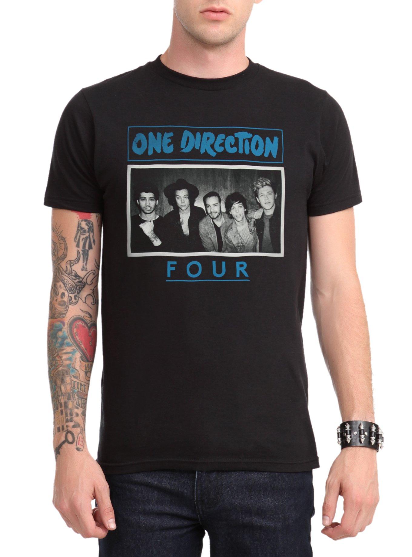 One Direction's Harry Styles sports KISS tour T-shirt as he lands in New  York