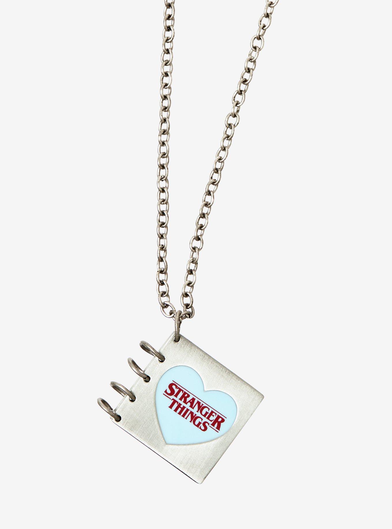 Stranger Things Snow Ball '84 Book Locket Necklace | Hot Topic