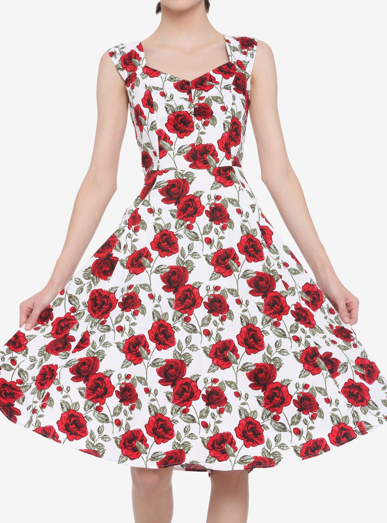 White dress with store red roses