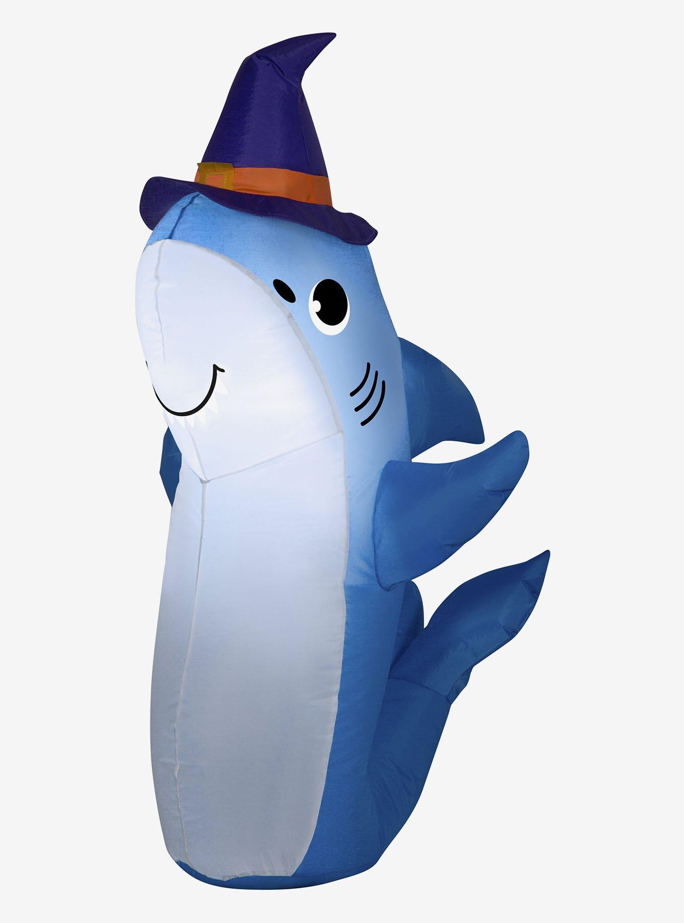 Cartoon shark mascot wearing a hockey jersey while
