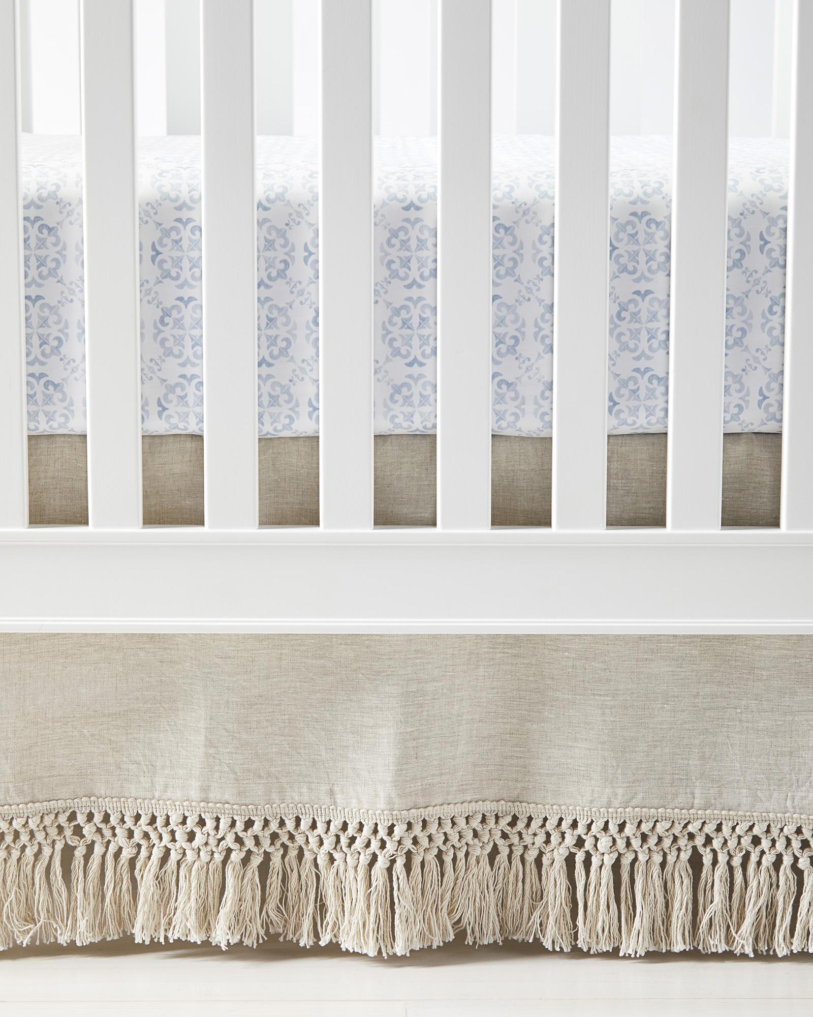 Crib skirt with outlet tassels