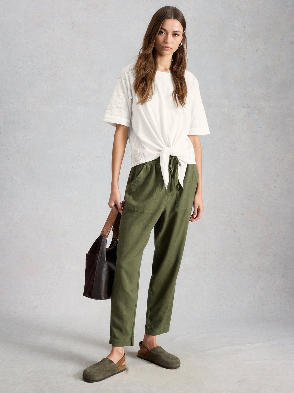 EMBROIDERED TIE HEM CREW NECK TOP