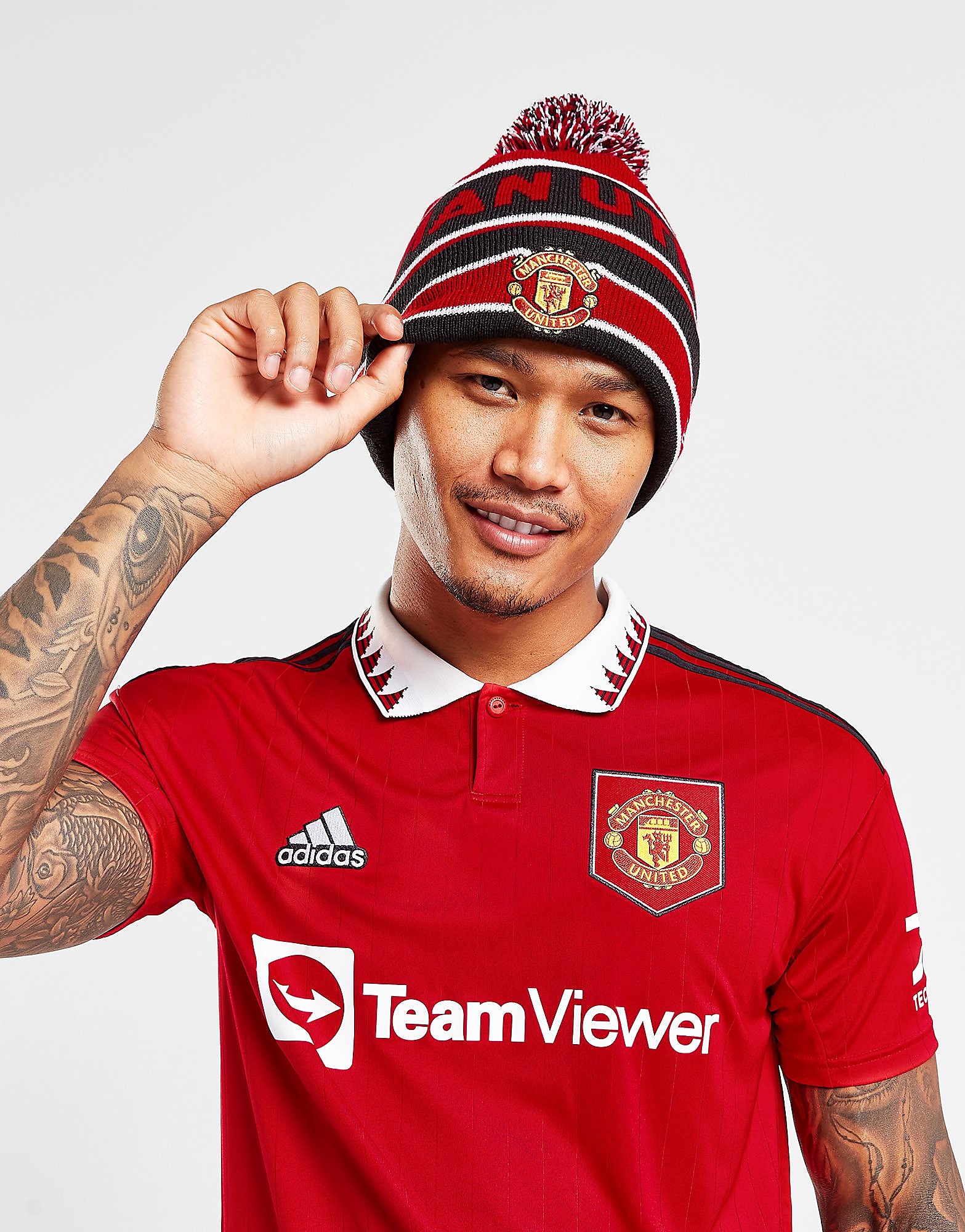 New Era Cappello Beanie Manchester United FC con Pon Pon, rosso