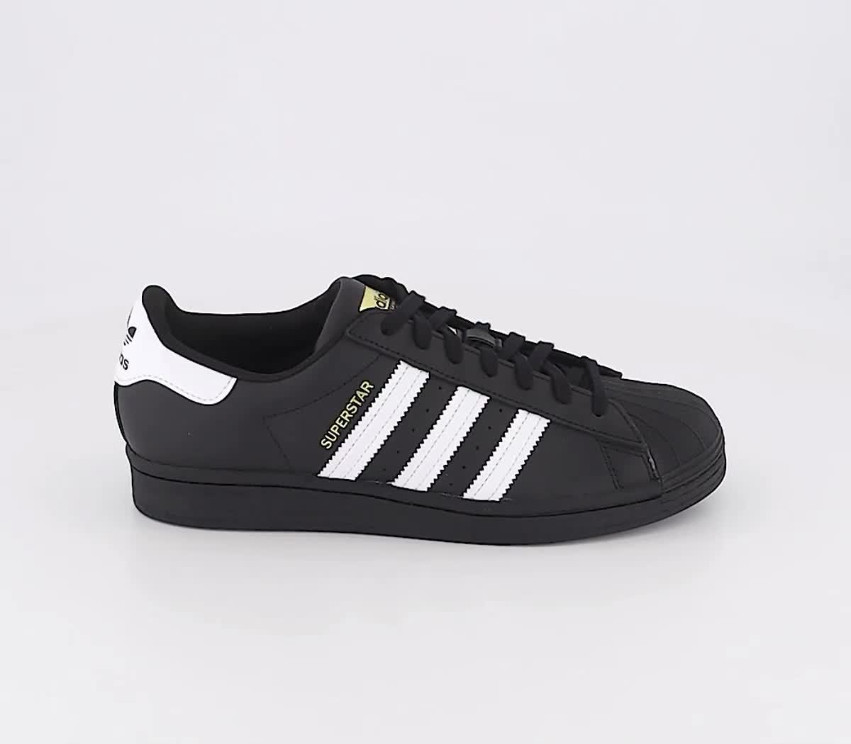 Black and white adidas on sale trainers