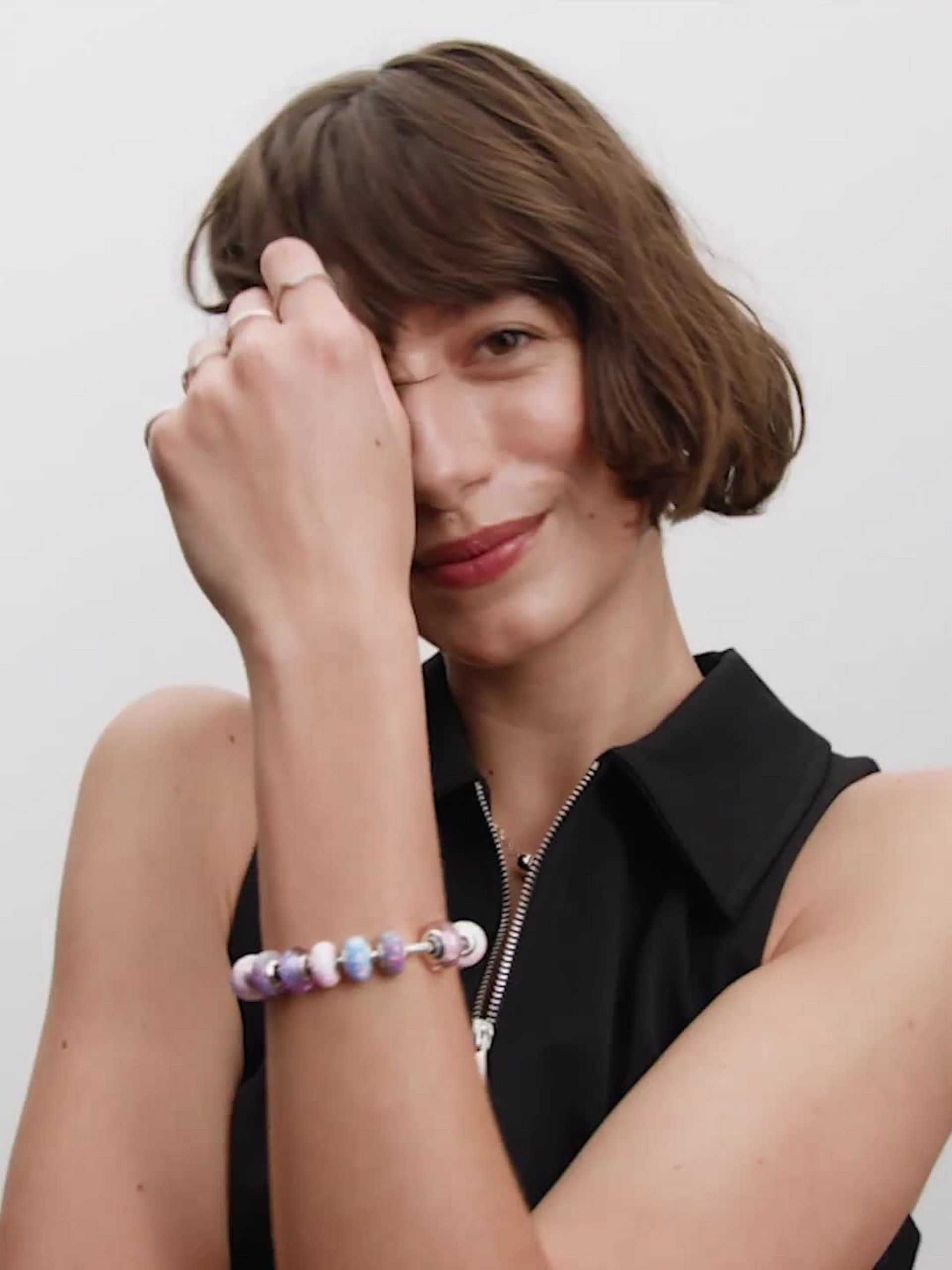 Wavy sterling silver charm with iridescent and lavender Murano glass